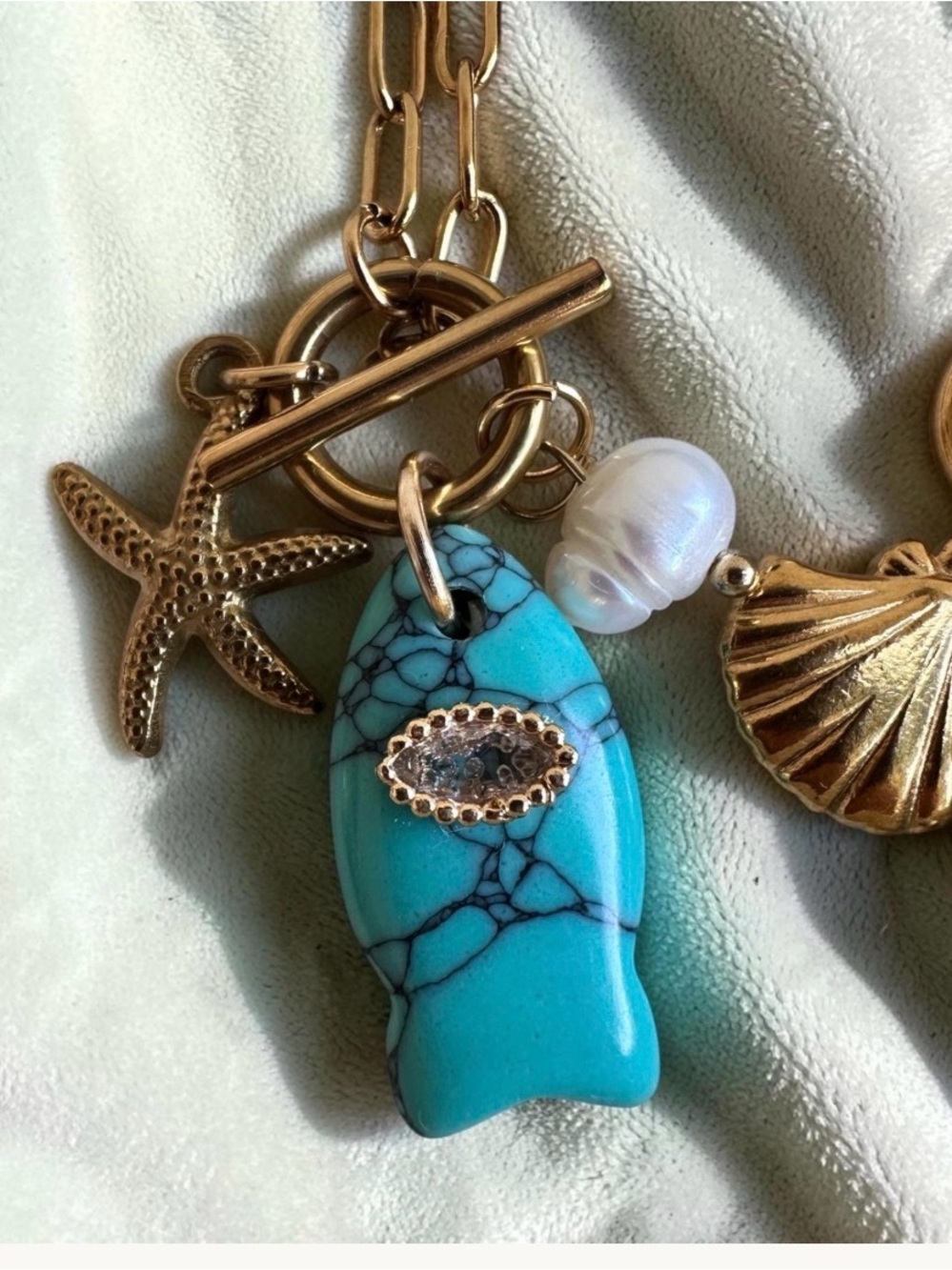 Gold Charm Necklace with Turquoise Fish Pendant and Pearl Accent